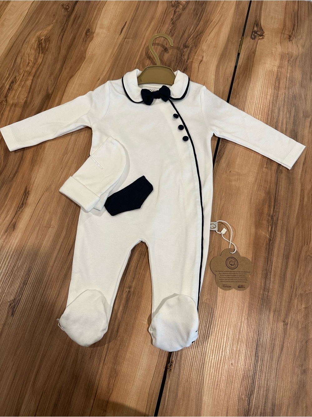 White Baby One-Piece with Navy Trim and Bow